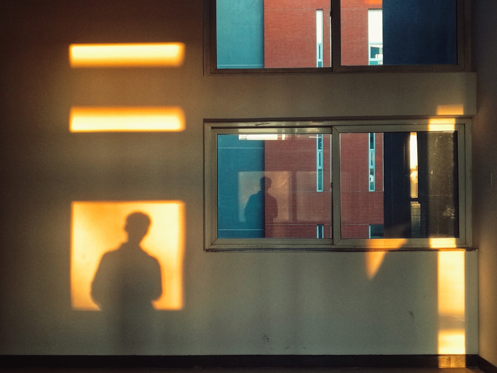 shadow of person near window