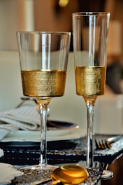 two gold wine and flute glasses