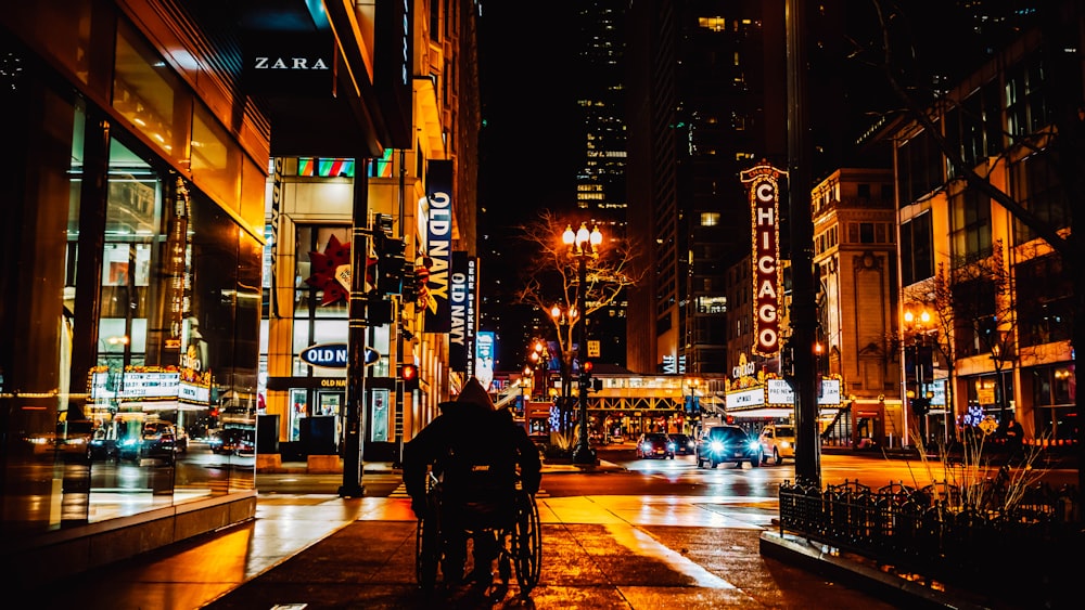 person on wheelchair on street during daytime