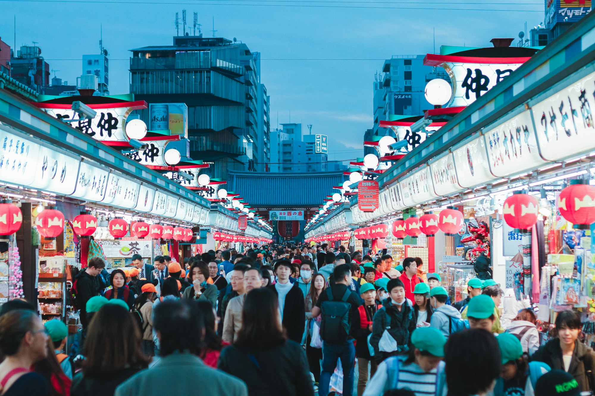 In front of the Sensoji Temple in Tokyo, there is a big market where clothes, food and even offerings are sold. I snapped this picture close to the evening as the lights in the market lit up.