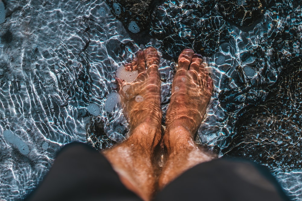 person standing on body of water