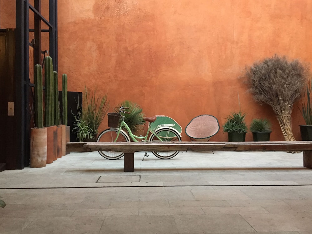 step through bicycle park beside wooden bench