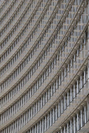 Close-up of modern metal facade lamella installation on a building exterior.