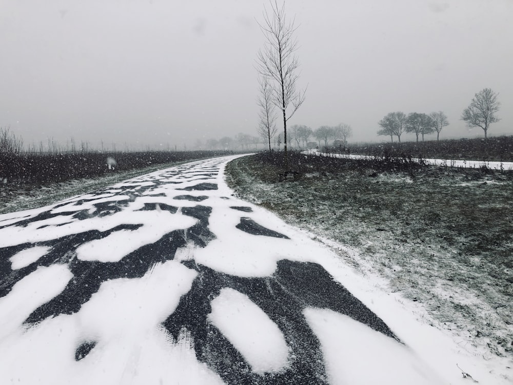 asphalt road covered with snow