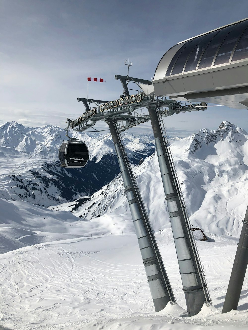 black cable car near station over the snowfield
