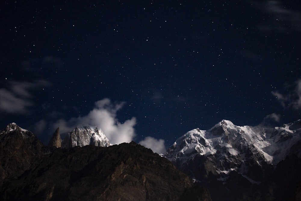 snow capped mountain under starry sky