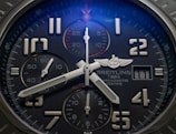 round gray and black Breitling chronograph watch at 4:42