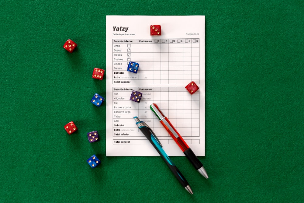 assorted-color dice on green surface