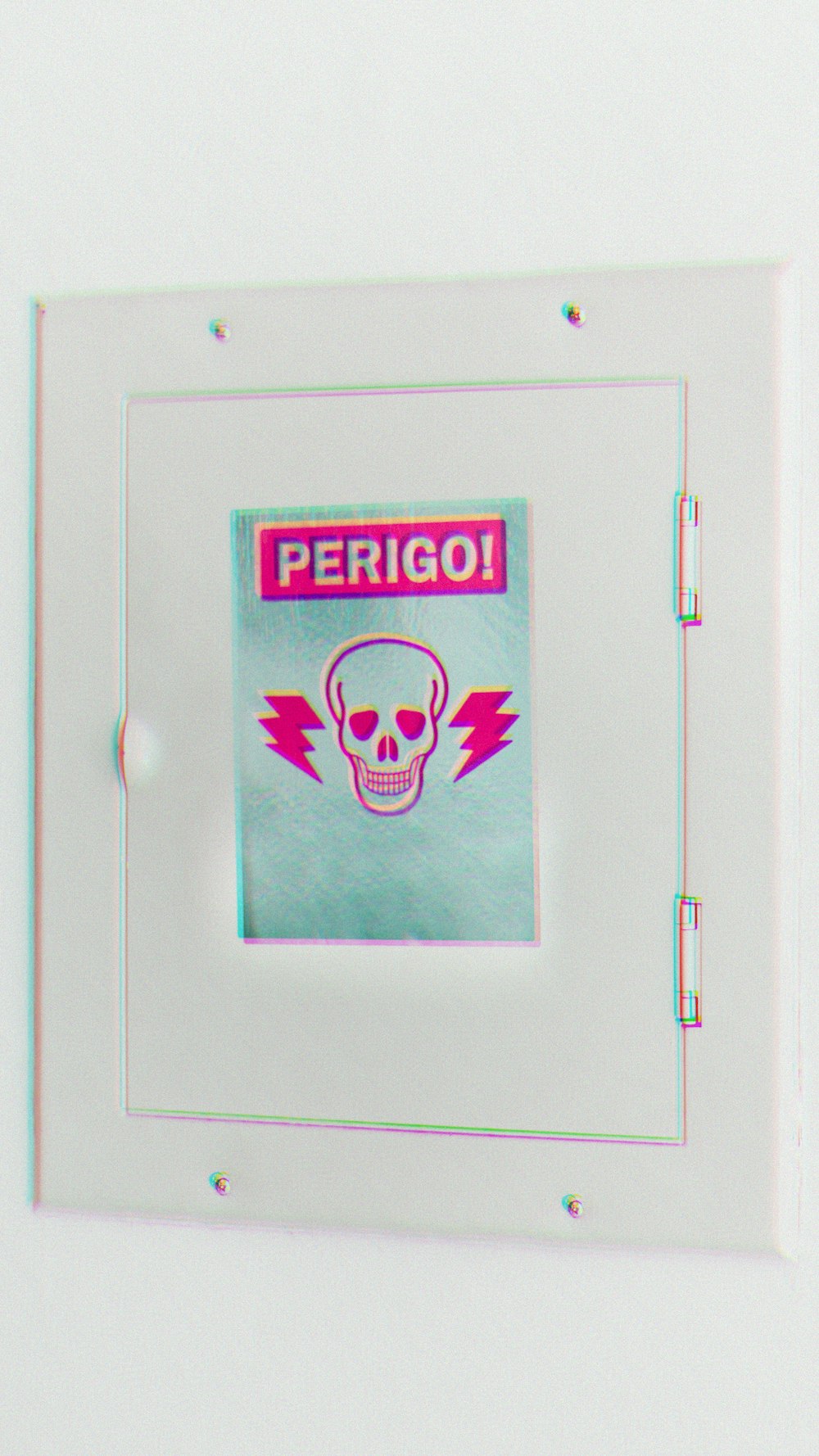 green and pink Perigo! sticker on white electric panel board