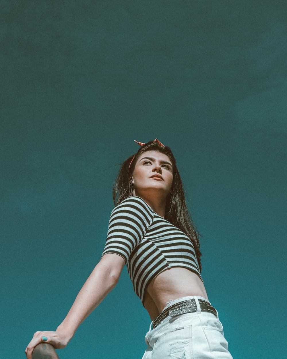 woman wearing white and black stripe crop-top