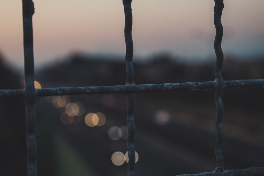 closeup photography of white fence