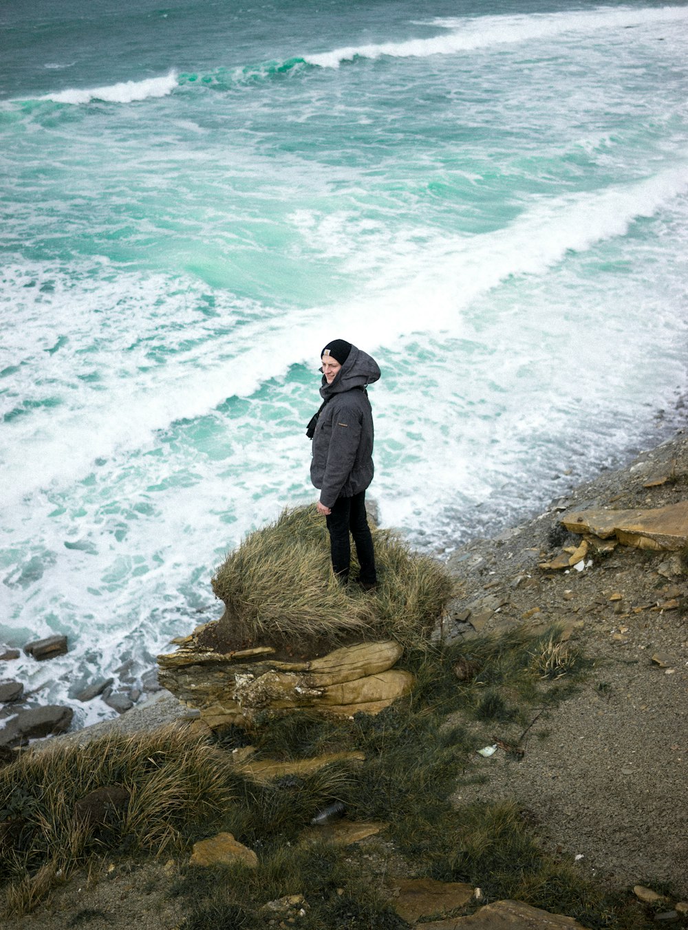 person standing front of body of water