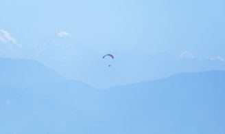 a couple of kites that are flying in the sky