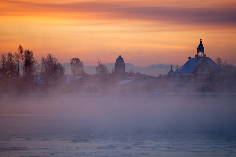 city covered by snow during golden hour