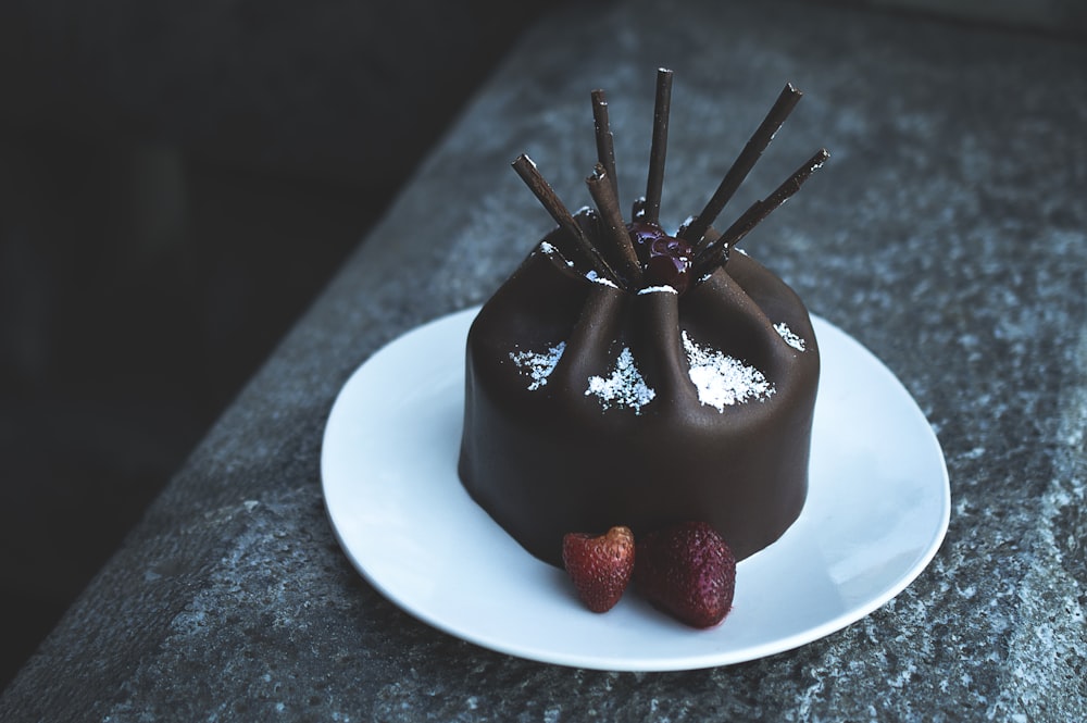chocolate cake with raspberry on plate