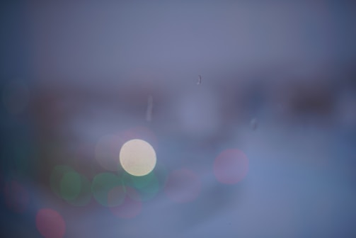 Abstract background with soft glassmorphism effect and subtle shadows.