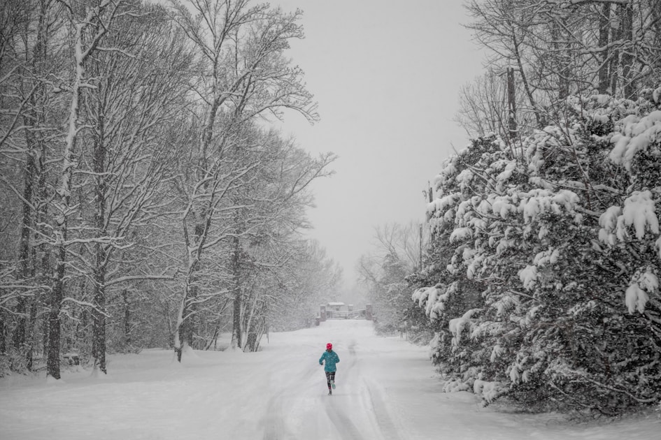 Athlete wearing a merino wool base layer during a cold weather trail run