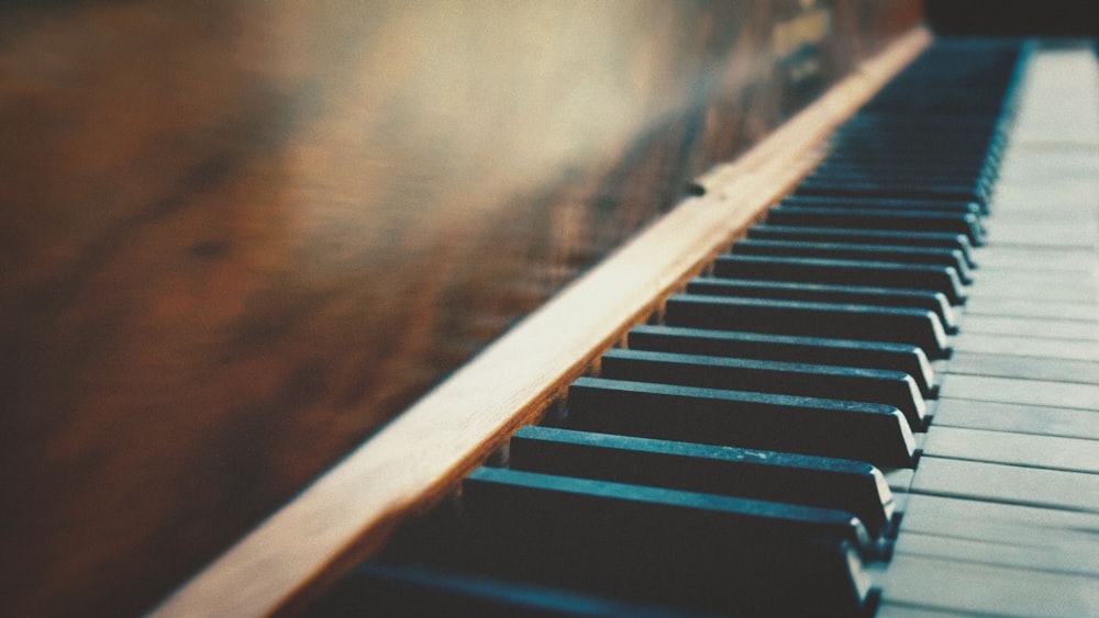 shallow focus photo of piano