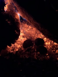 A warm, glowing ember scene with soft light.