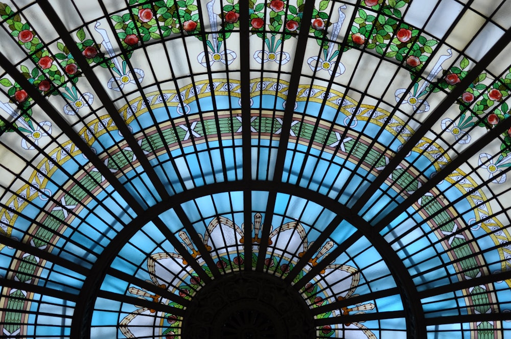 low-angle photography of stained glass dome