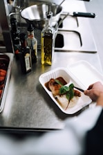A caregiver preparing a meal for a client.