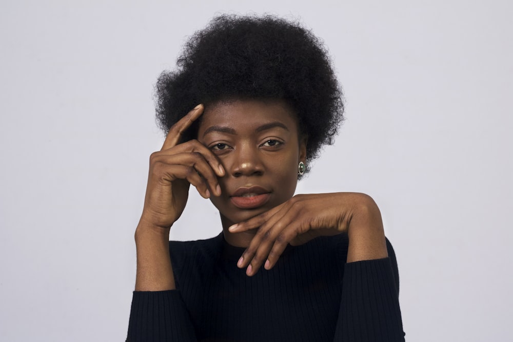 woman in black long-sleeved shirt posing