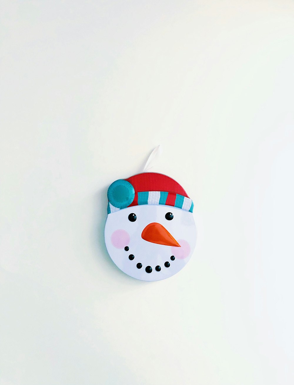 red and white Snow Man wall ornament