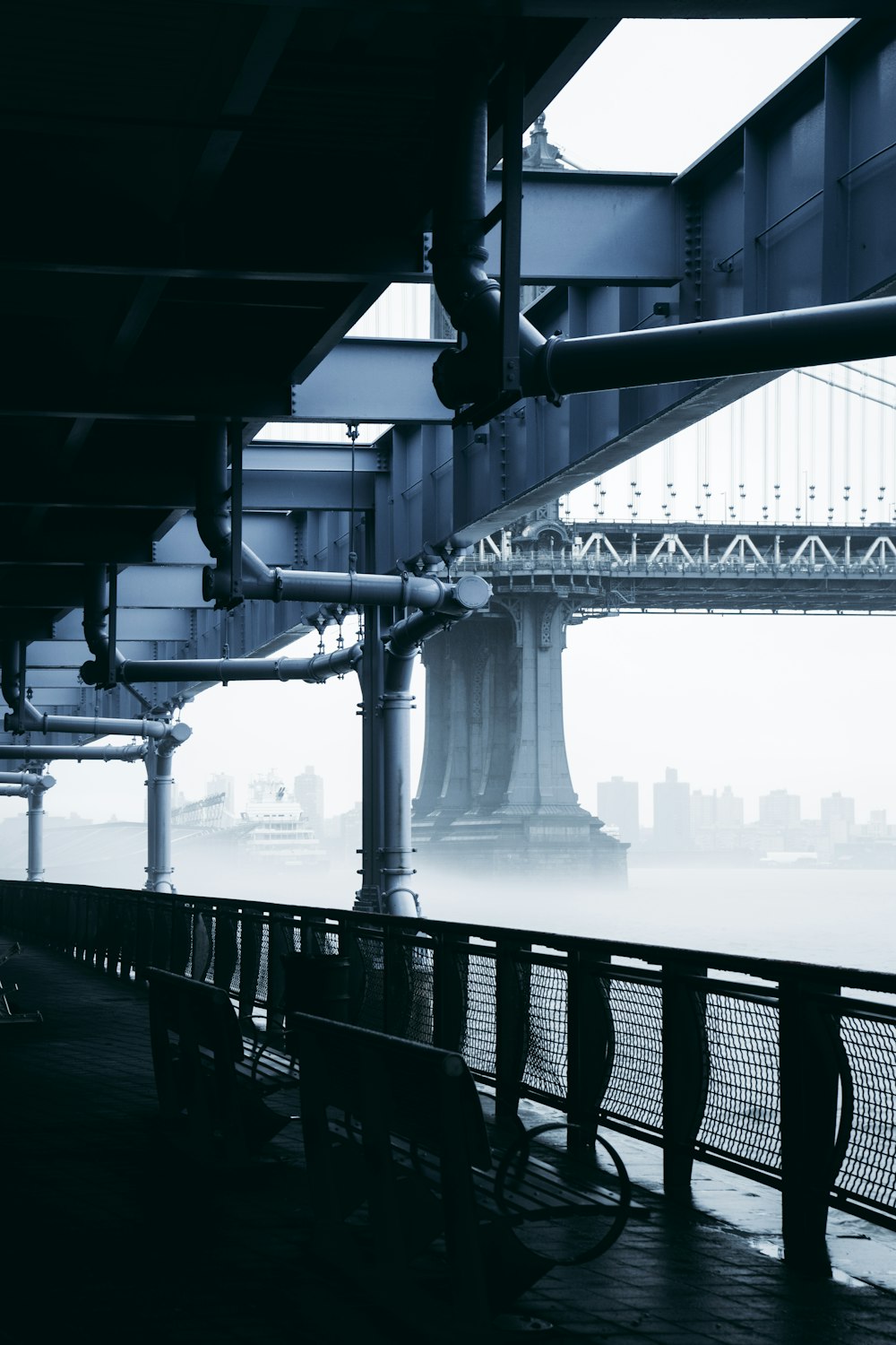 bench front of bridge