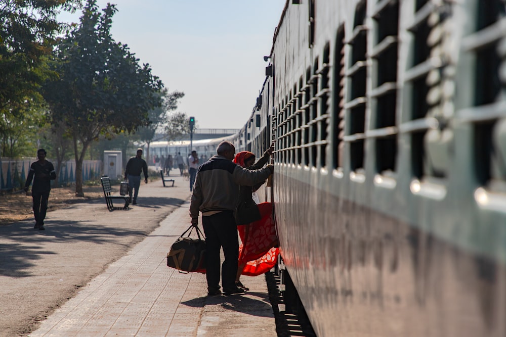 man and woman moving inside train