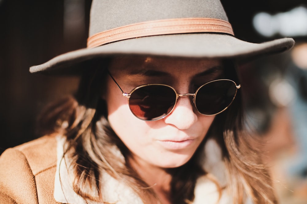 woman in sunglasses on focus photography