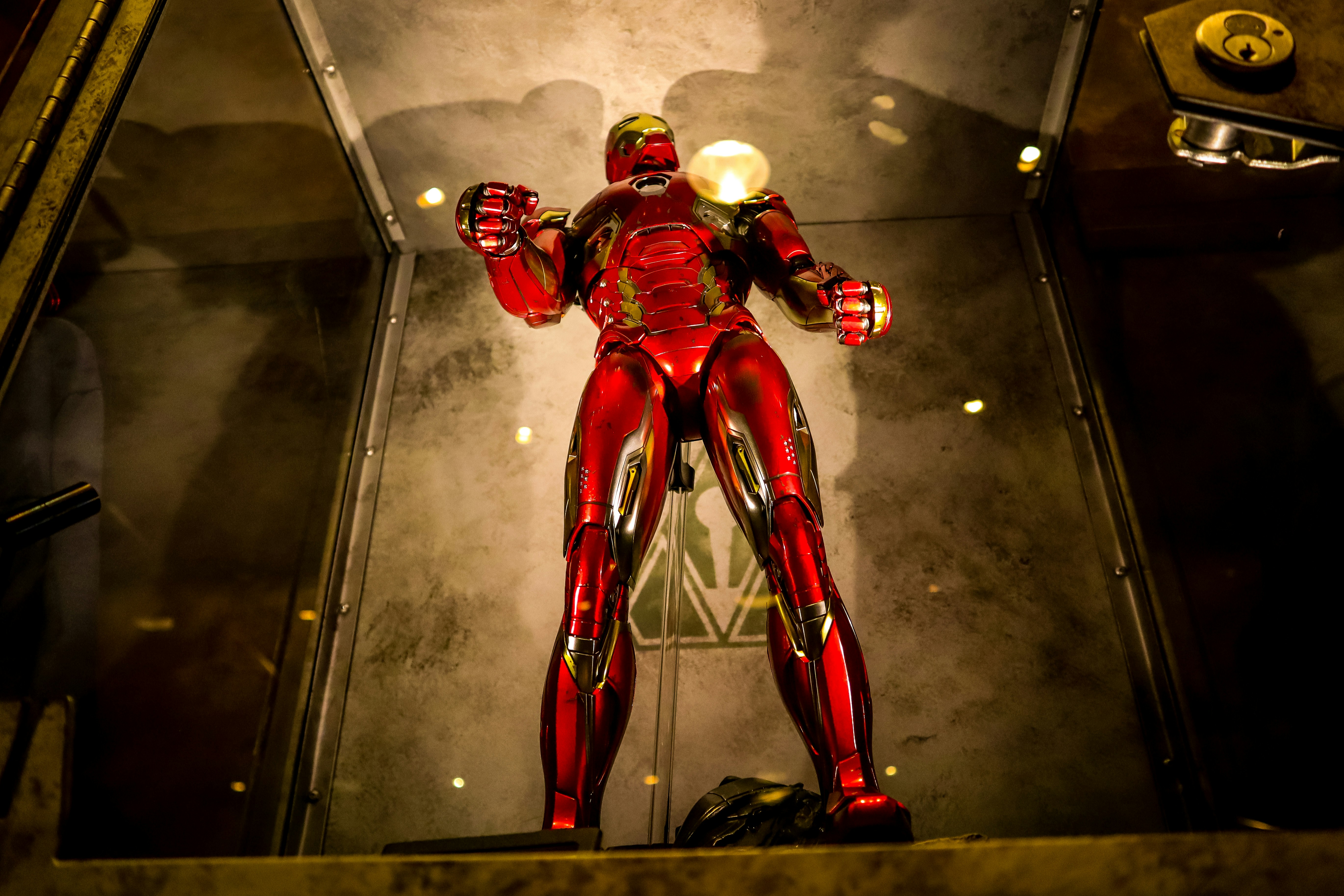 Iron Man figure with accessories spread out including hand sets and display stand in studio lighting