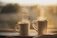 A cozy kitchen scene with three puzzle mugs arranged side by side, steam rising gently from each.