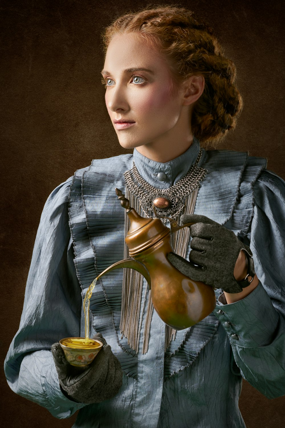 woman holding turkich teapot