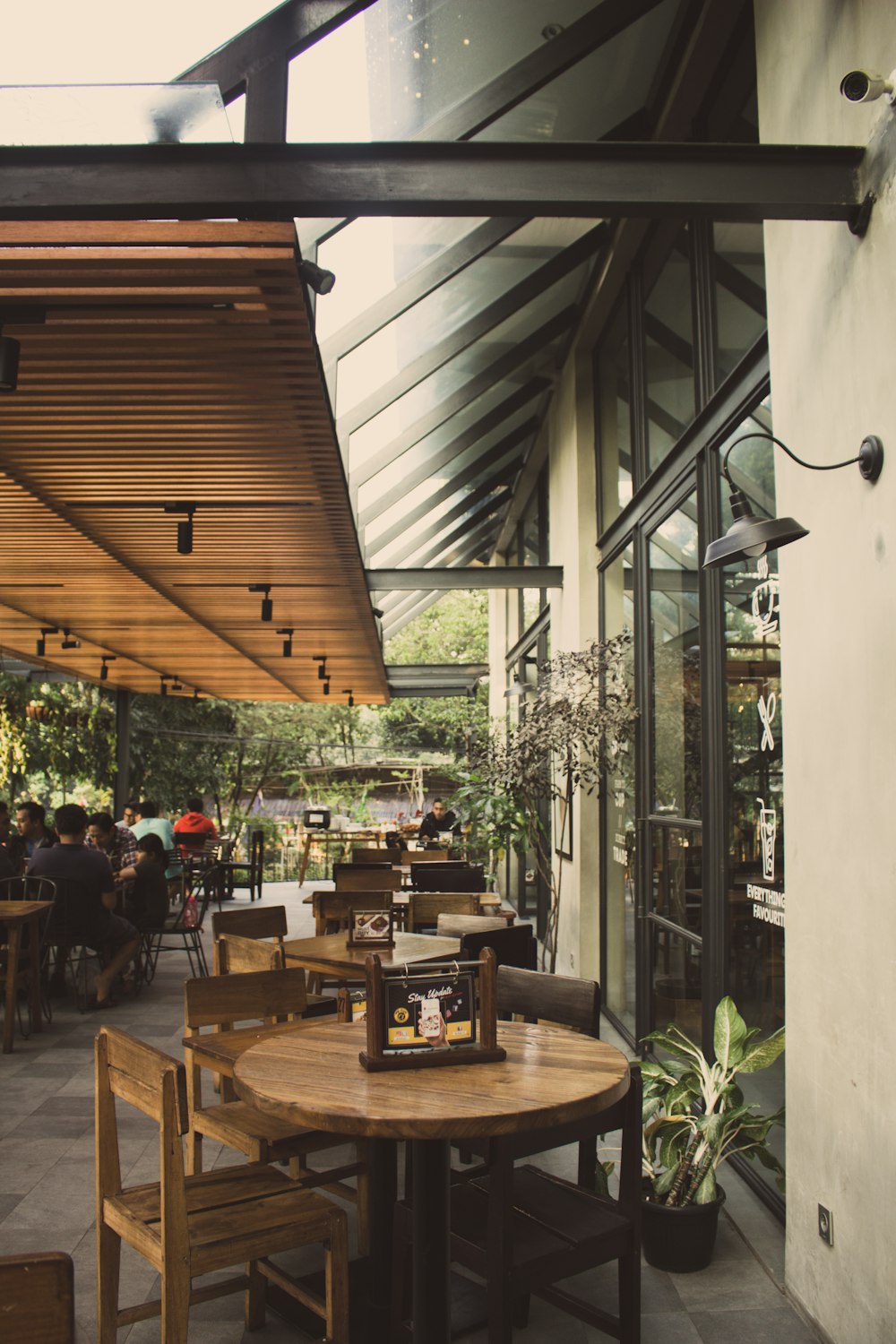 a restaurant with a wooden table and chairs