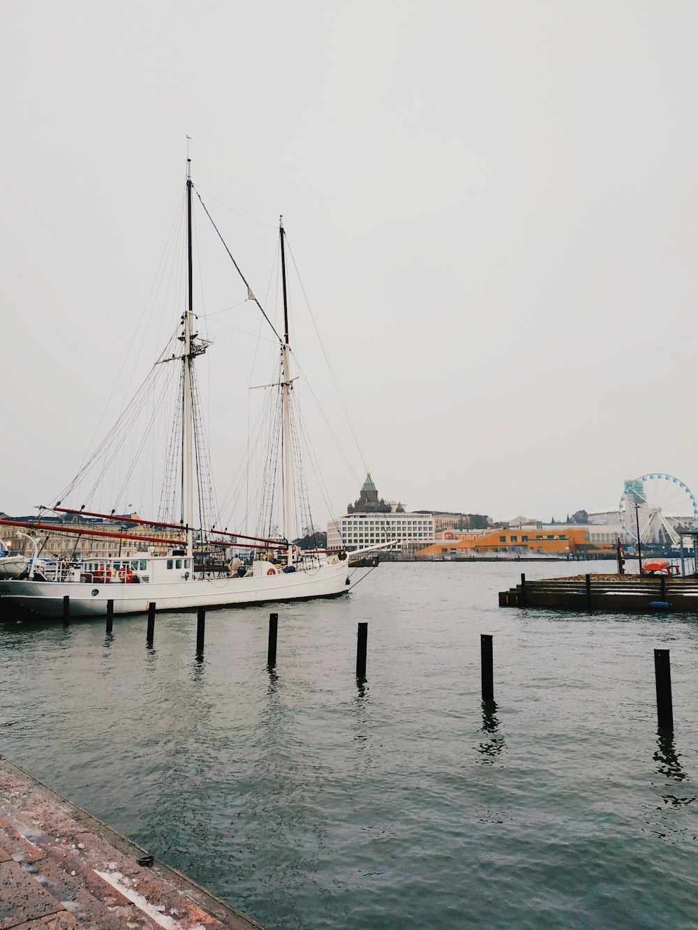 white boat on body of water during daytime