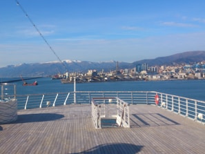 A freshly built deck overlooking Kachemak Bay with rugged mountains in the background.
