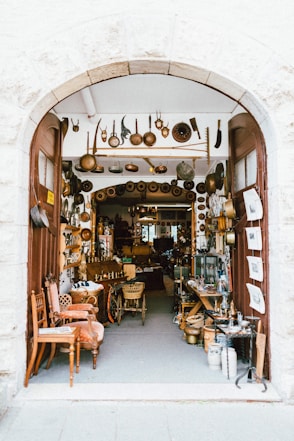 empty chairs and tables with kitchenware display