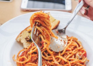 selective focus photography of fork with spaghetti