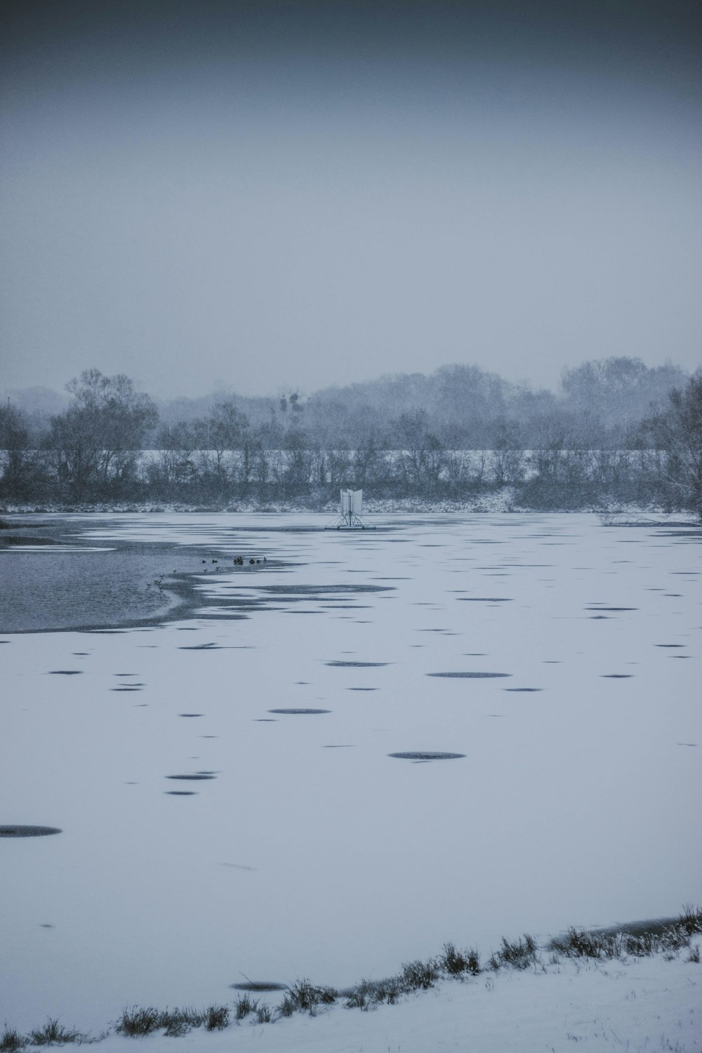 body of water under blue sky