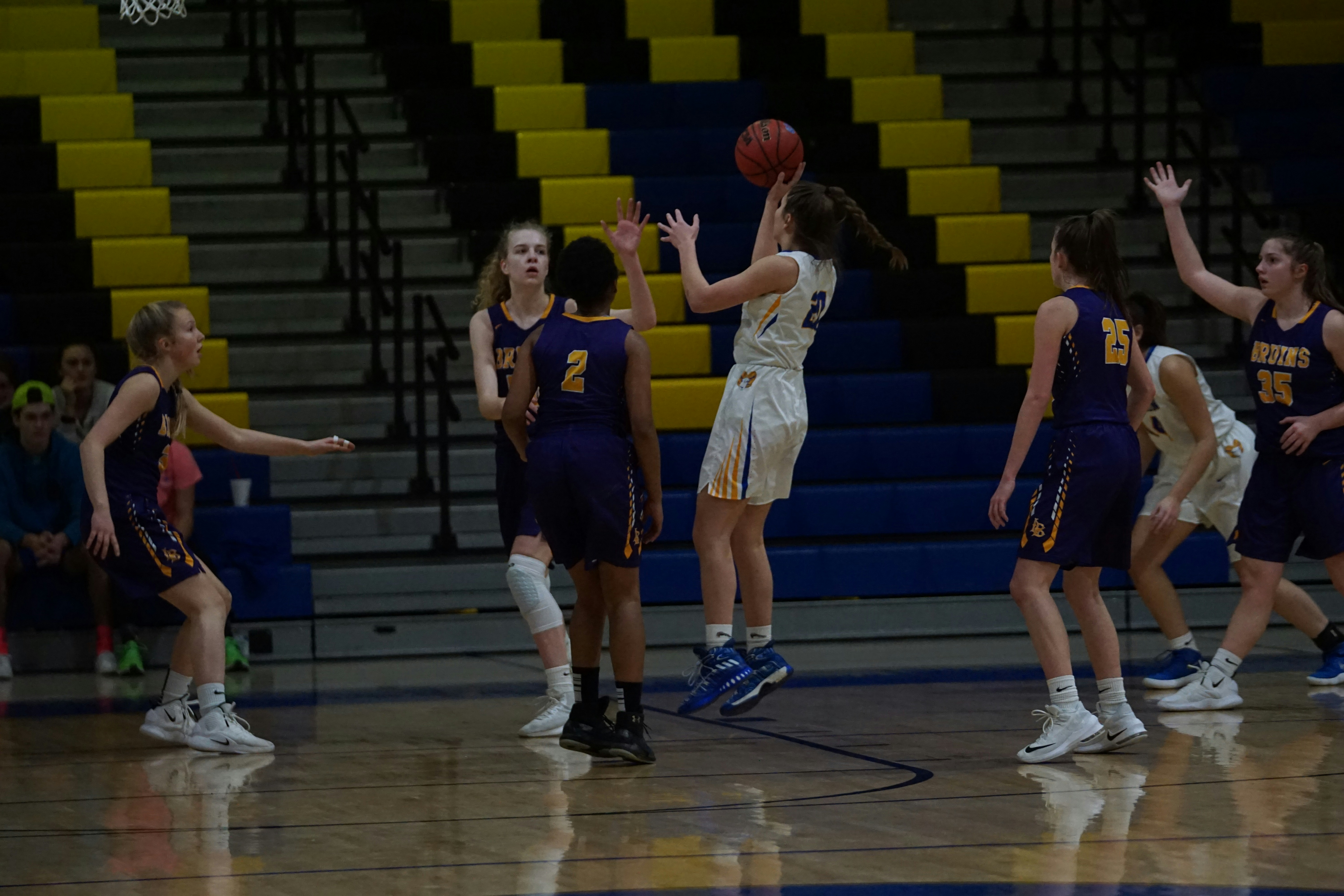 girls playing basketball inside court