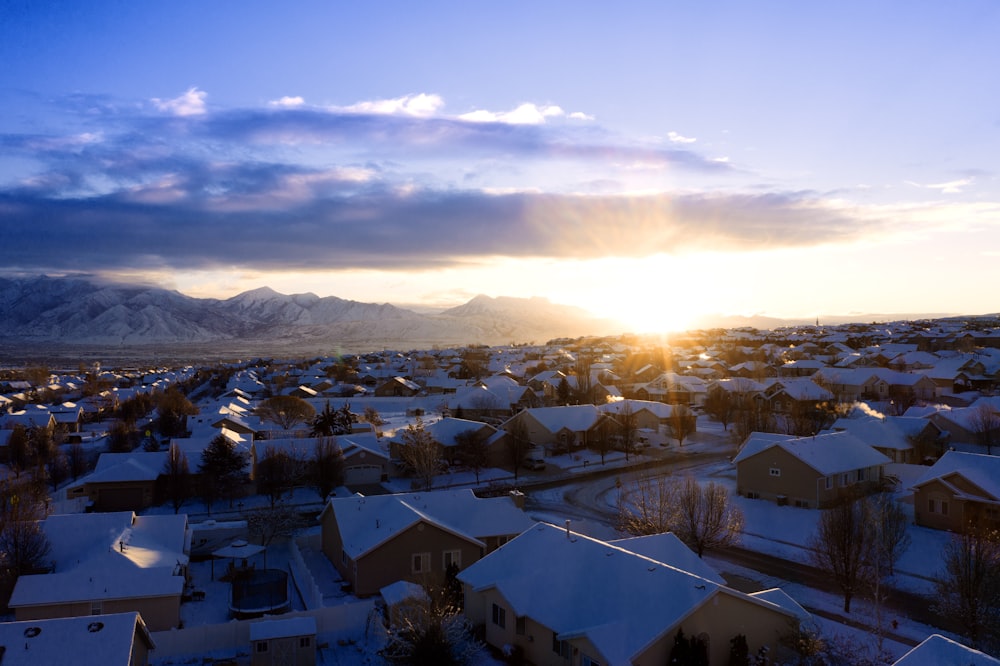 houses covered with snow during golden hour