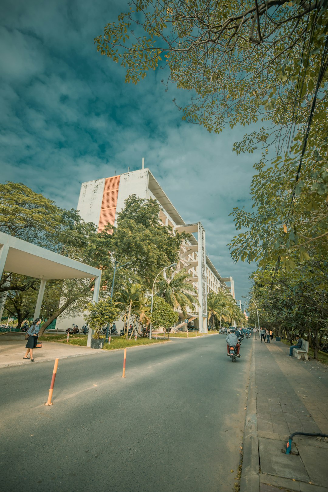 view of white painted building under cloudy sky