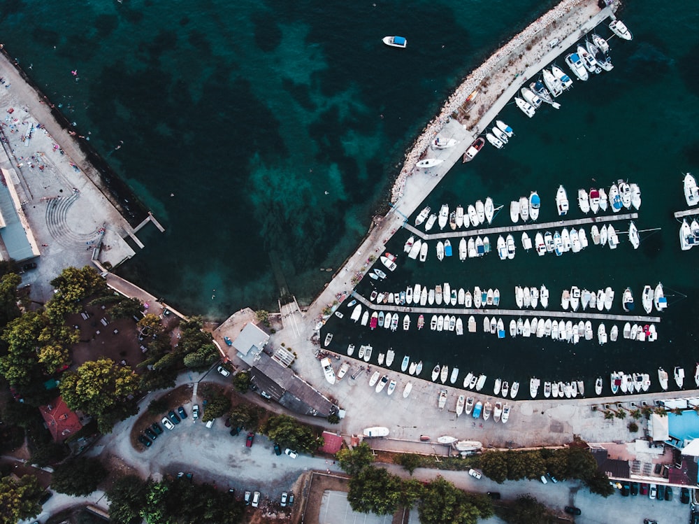 high angle photography of boats beside sea dock