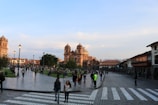 A bustling plaza filled with people and shops.