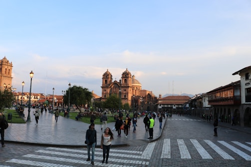 A bustling plaza filled with people and shops.