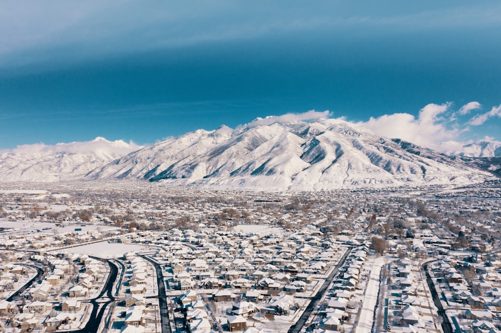 high-angle photography of buildings near mountians