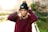 woman wearing black bobble hat standing