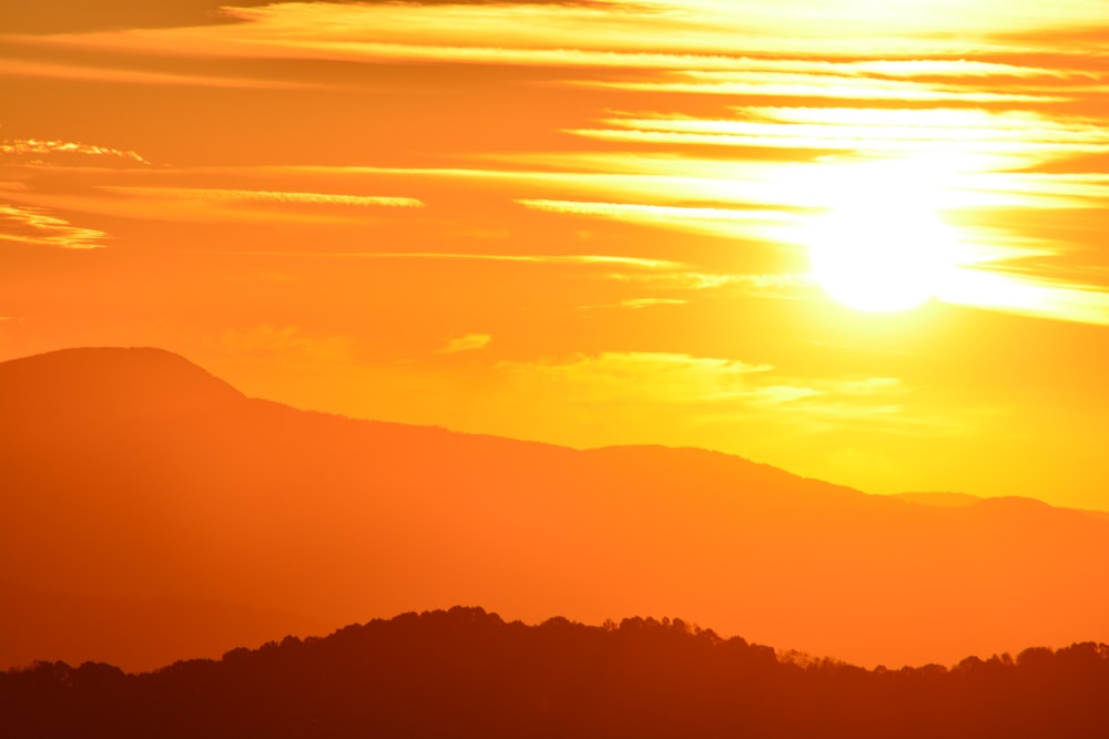 silhouette of mountains during golden hour