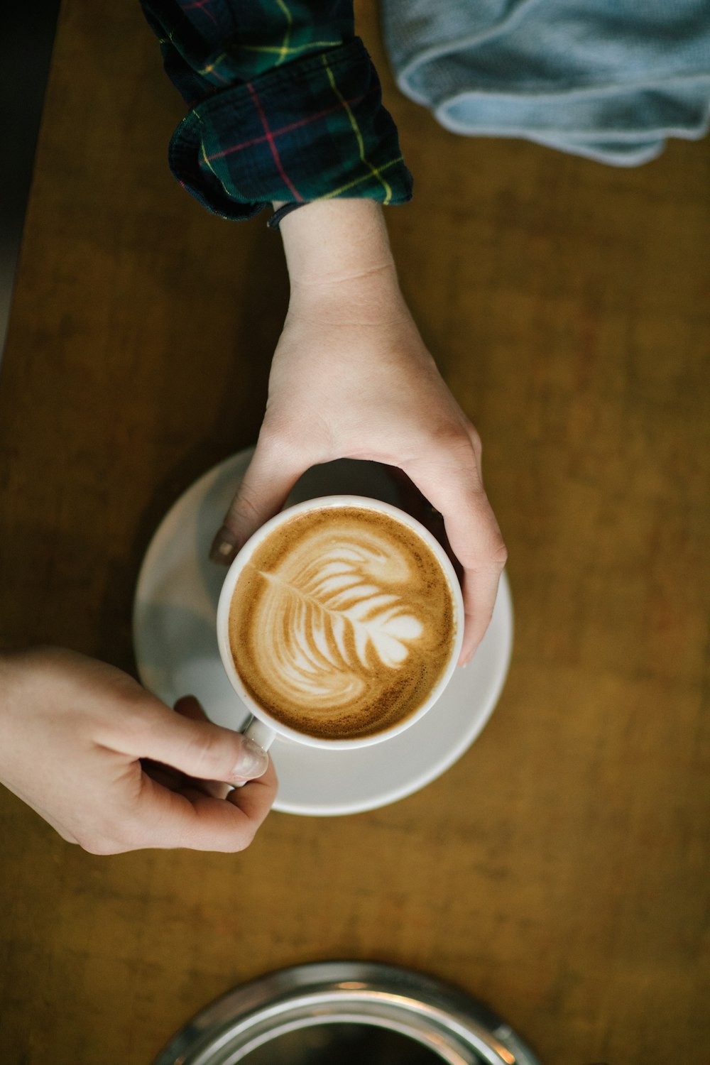 person holding cup of coffee