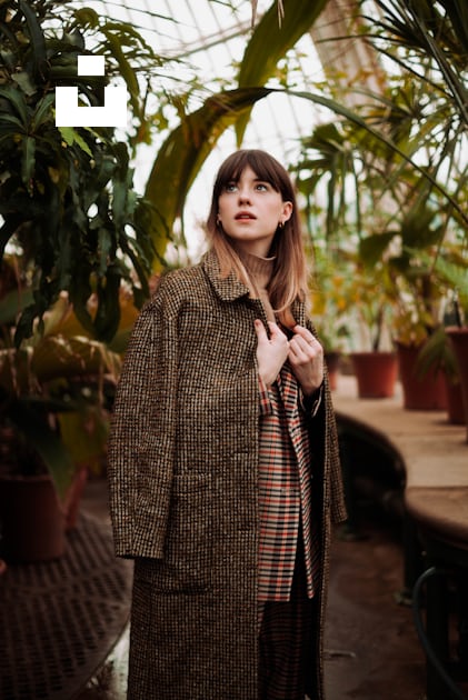 Woman wearing brown coat near plants photo – Free Fashion Image on Unsplash